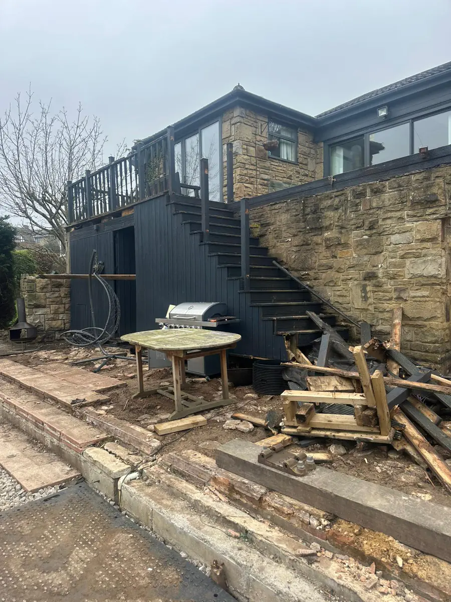 Rear garden piled with rubble and waste before Mukin clearance
