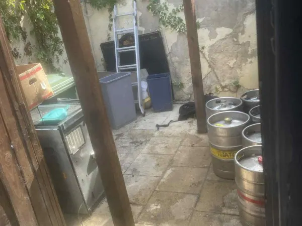 York pub backyard with beer kegs and bins ready for Mukin commercial waste pickup