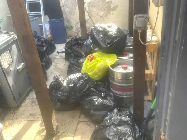 York pub backyard with bin bags, kegs and trade waste ready for Mukin collection