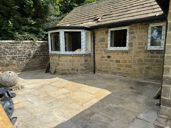 Stone-paved patio in York left clean after a Mukin garden clearance
