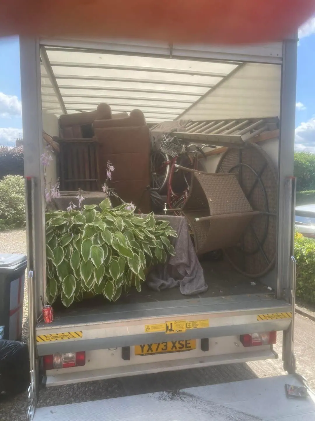 Mukin removals van loaded with sofa, plants and household furniture during a York house move