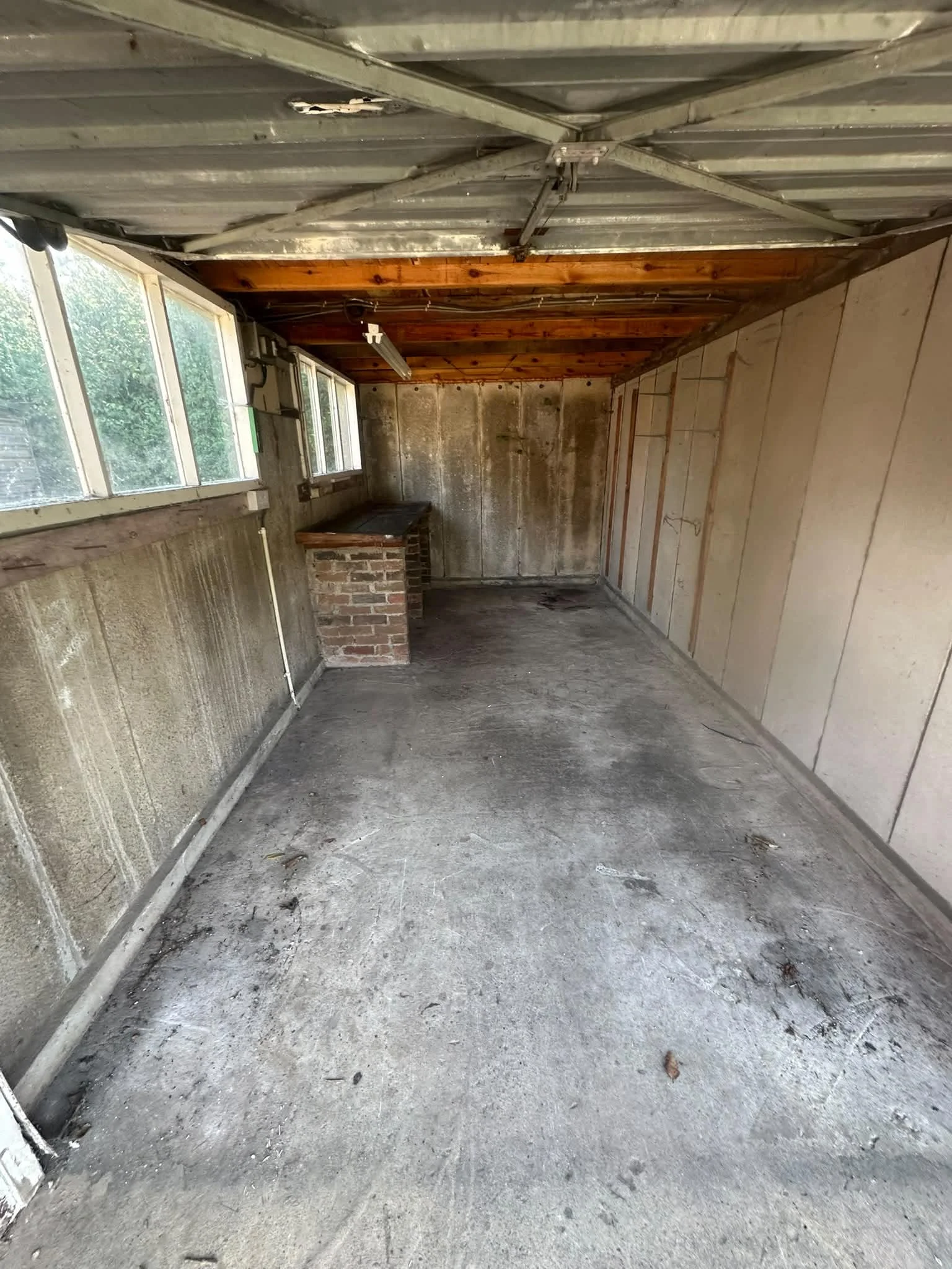 The same York garage after clearance by Mukin, emptied down to the brick bench and swept floor