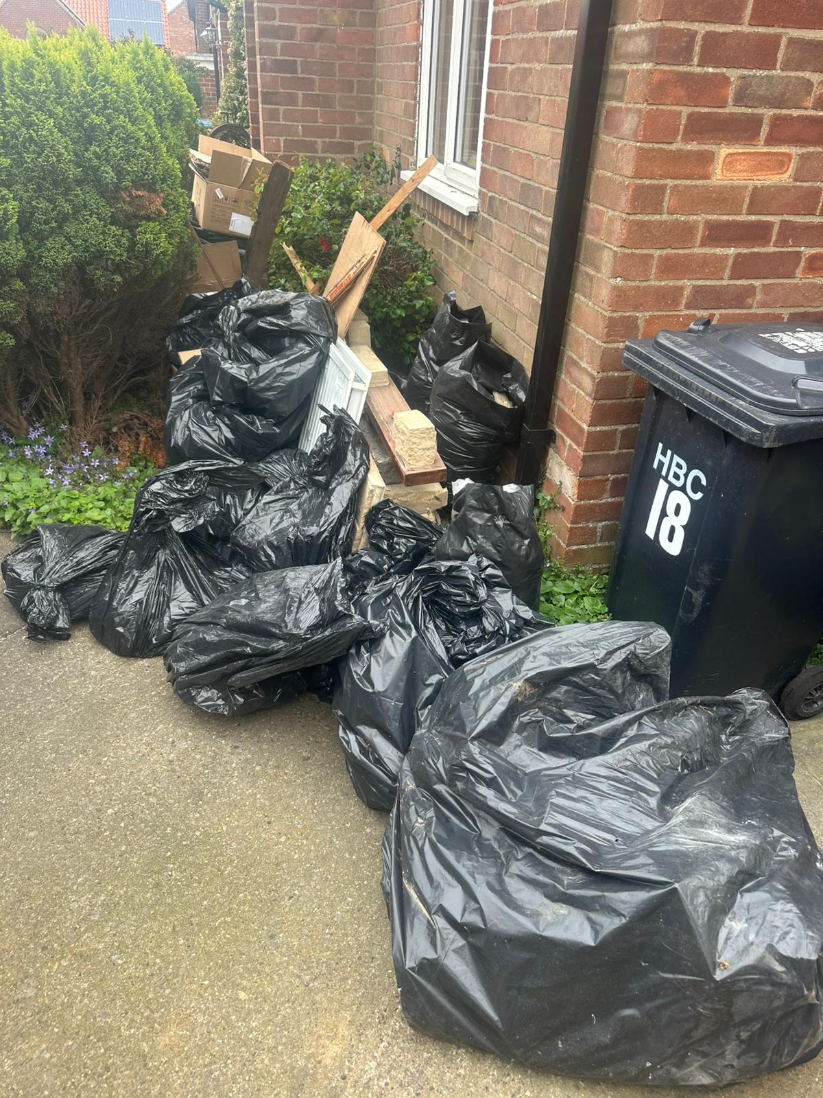 Black waste sacks and a general waste bin piled outside a York house before collection by Mukin